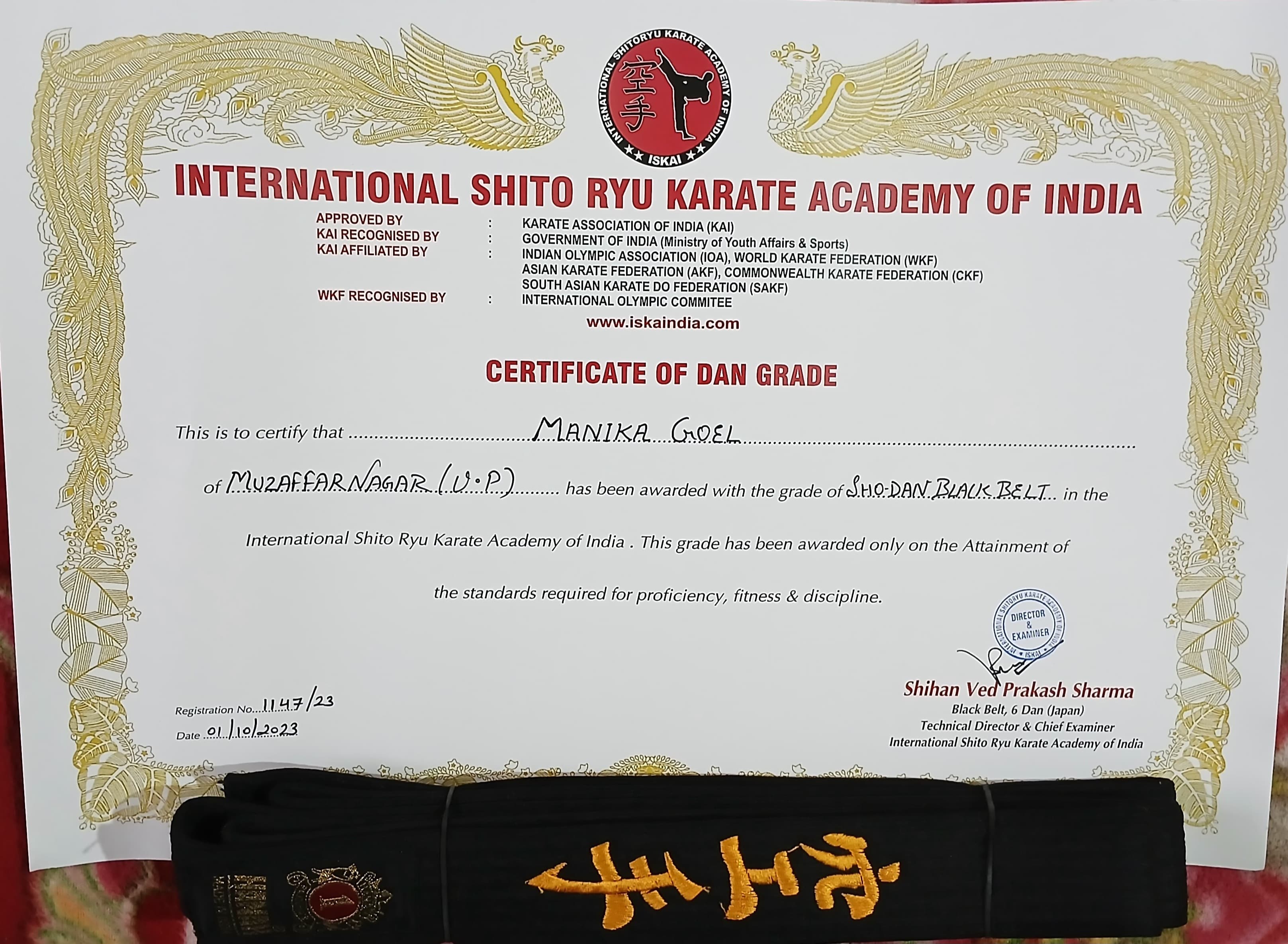Manika Goel's black belt alongside her official rank certificate