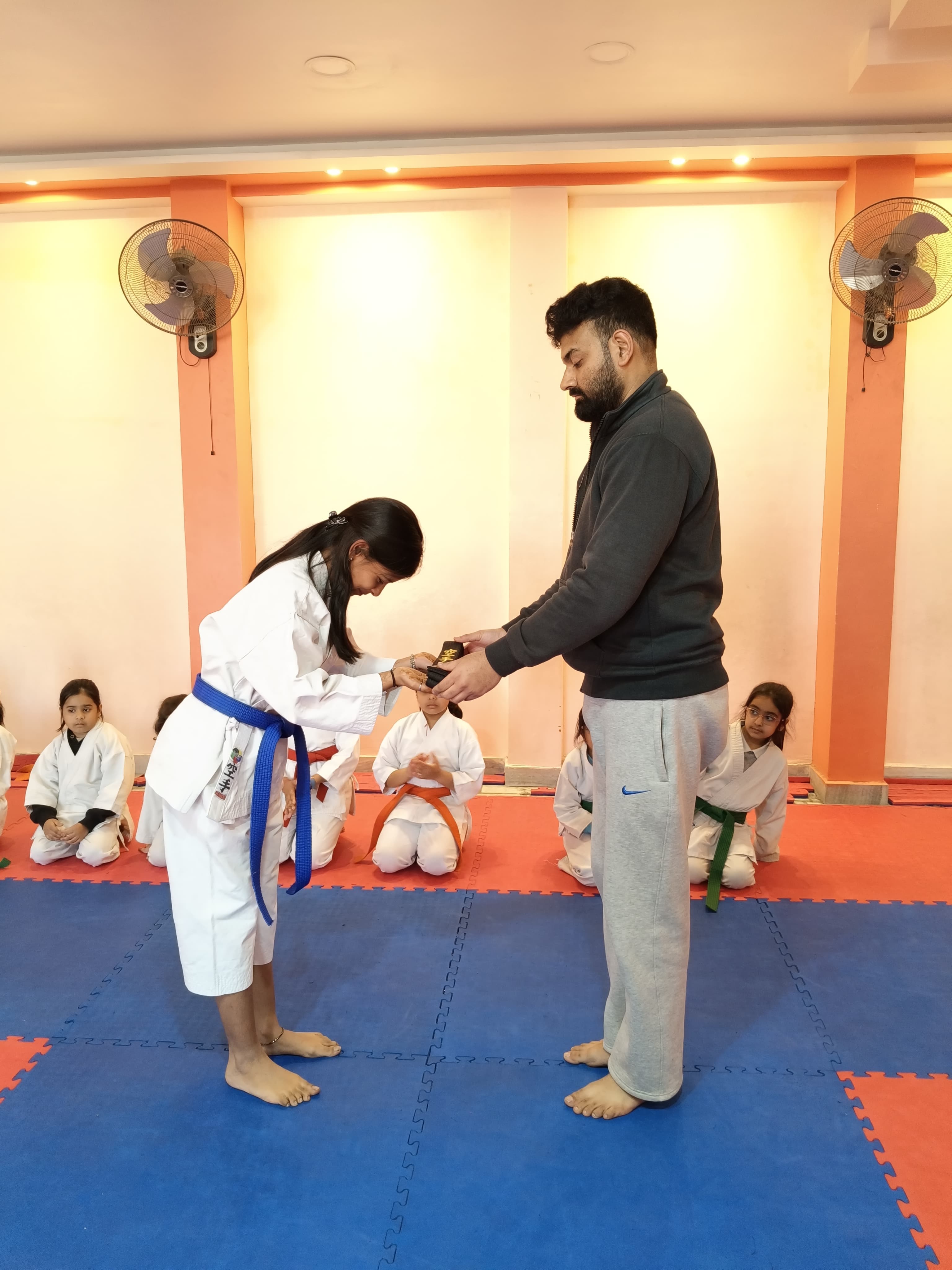 Manika Goel receiving her black belt
